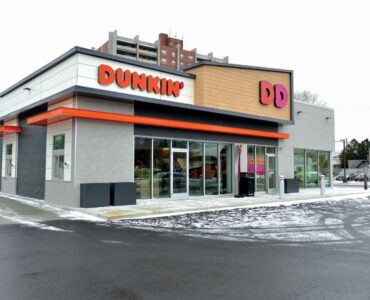 The Dunkin Donuts in Quincy, Massachusetts, featuring Spectrum Facades in Trespa® Pura NFC® PU 02 Classic Oak finish