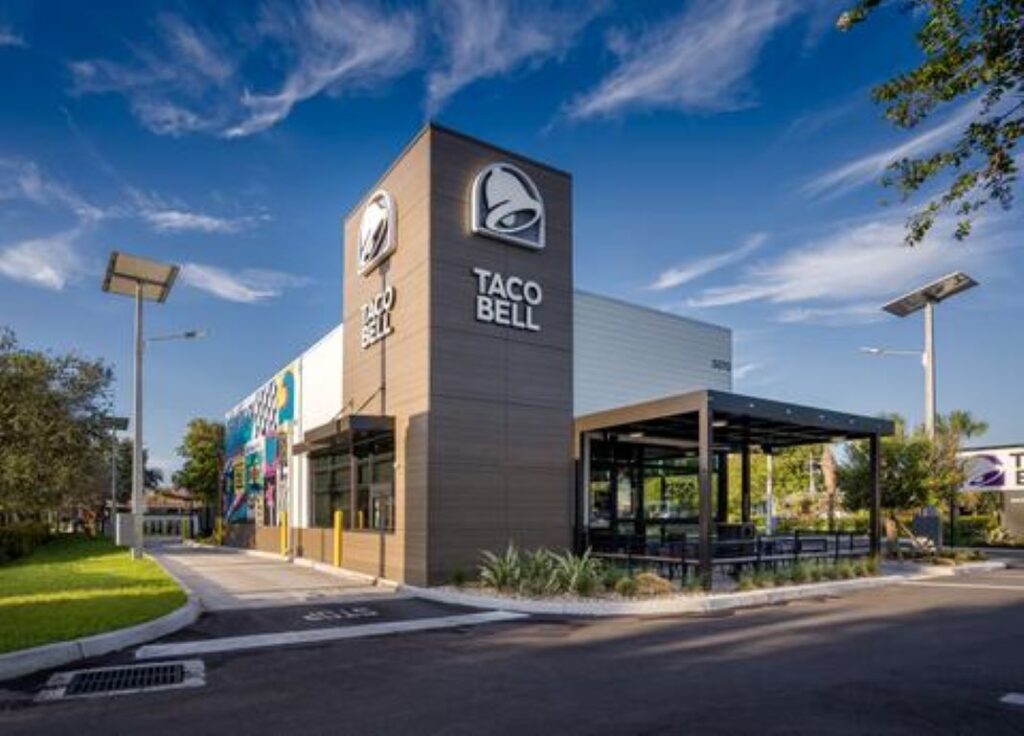 An exterior view of the Taco Bell building featuring a French Walnut finish