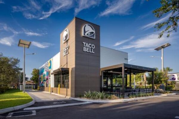 An exterior view of the Taco Bell building featuring a French Walnut finish